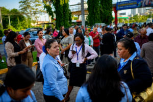 Colombia earthquake aftermath with a large crowd gathered outdoors as people respond to the emergency and assess the situation.