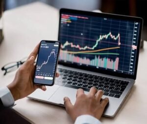 Gemini AI for crypto concept showing cryptocurrency market charts on a laptop and smartphone for real-time trading analysis.